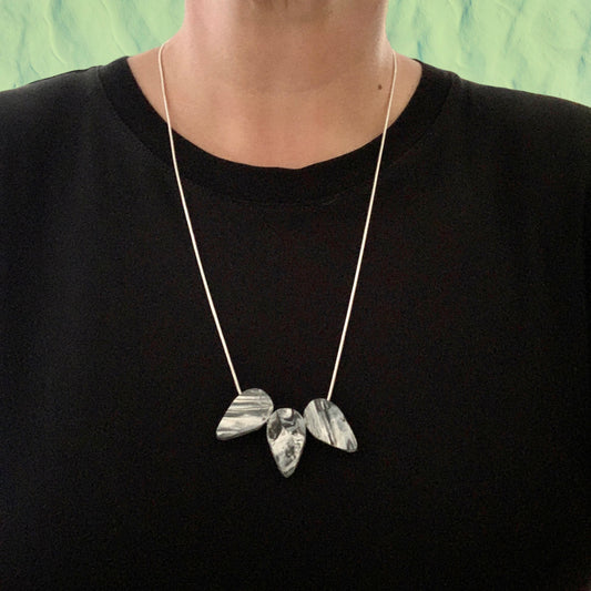 Black and white teardrop necklace handmade in London from recycled single use plastic perfect gift awards 2023