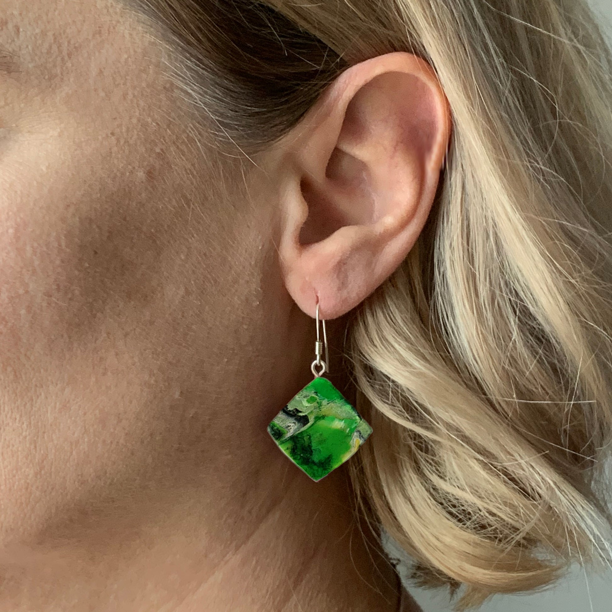 Green earrings made from plastic waste